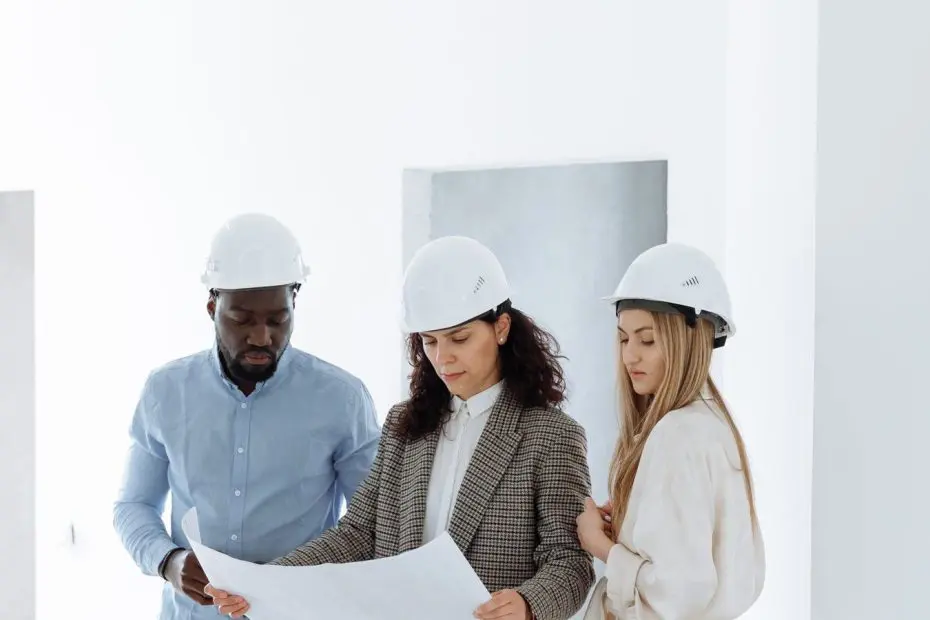 Contractor SEO example: team in hard hats reviewing plans inside a newly built home