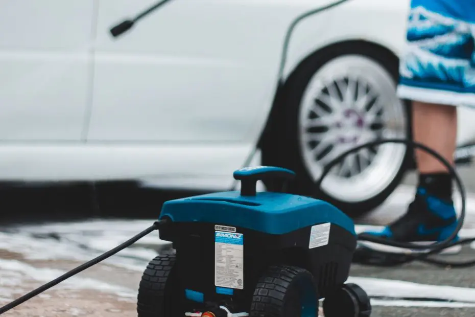 Pressure washer in use on a driveway